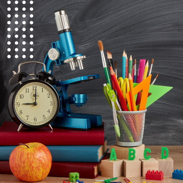 Clock, microscope, pencils and other school supplies